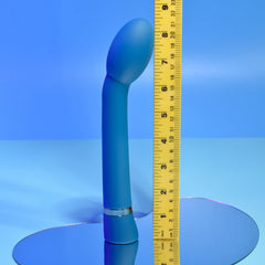 Playboy On The Spot vibrator beside measuring tape showing approximately 8-inch length