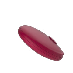 Profile view of Gizi Duo wireless remote showing slim oval shape and single control button