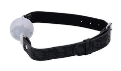 Profile view highlighting lace-patterned strap design and white silicone ball gag connection point
