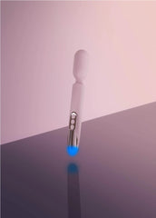 Prowand wand vibrator standing upright with blue LED charging light glowing at base