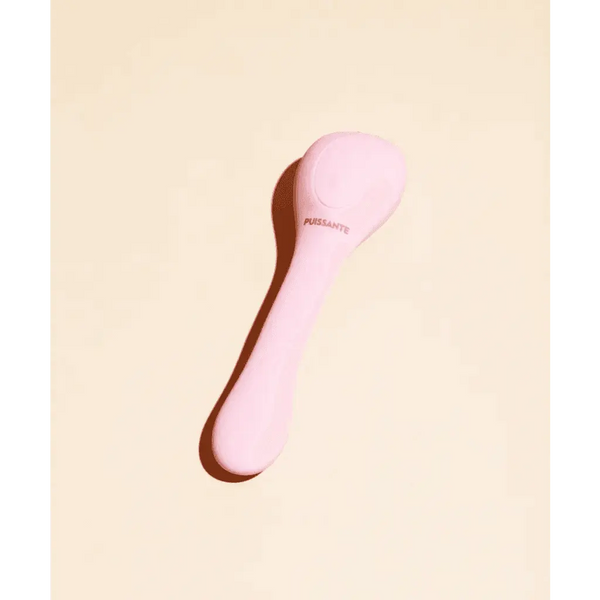 Puissante Coco Dual Stimulator in soft pink silicone, front view on cream background