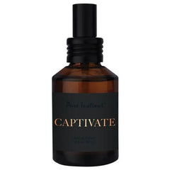 Pure Instinct Captivate 2 fl oz amber glass spray bottle shown alone on white background