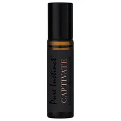 Pure Instinct Captivate amber glass roll-on bottle with black cap, isolated on white background