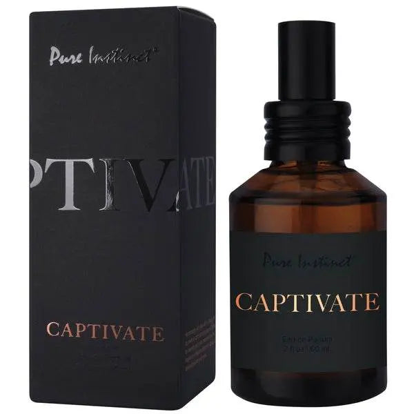Pure Instinct Captivate amber glass spray bottle beside its matte black box