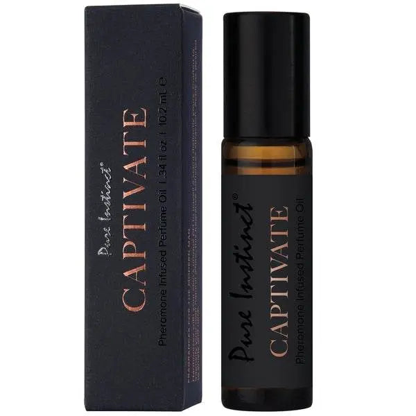 Pure Instinct Captivate roll-on perfume oil beside its matte black box with rose-gold lettering