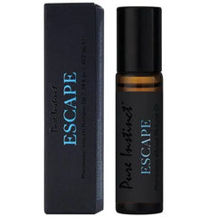 Pure Instinct Escape pheromone roll-on perfume oil beside its dark navy gift box