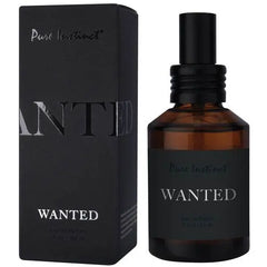 Pure Instinct Wanted Eau de Parfum amber spray bottle beside sleek black box