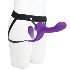 Purple dual-ended silicone dildo worn on a mannequin torso with adjustable black elastic strap-on harness