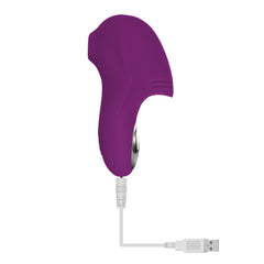 Purple finger vibrator connected to white USB magnetic charging cable, showing rechargeable functionality