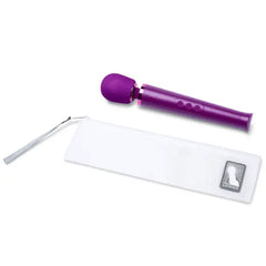 Purple Le Wand Petite wand massager beside its white zippered storage pouch