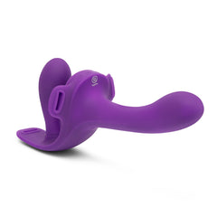 Purple silicone dual-ended dildo angled front view showing curved shaft and internal stimulation bulb