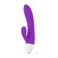 Purple silicone dual-stimulation rabbit vibrator with curved shaft and white base, side view