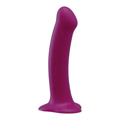 Purple silicone Magnum dildo showing slight upward curve and flat suction cup base
