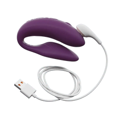 Purple We-Vibe Chorus couple's vibrator connected to magnetic USB charging cable