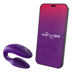 Purple We-Vibe Sync couple's vibrator beside smartphone displaying the We-Vibe app