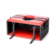 Queening Chair shown open, revealing interior space, oval cutout, and attached restraint straps