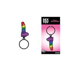 Rainbow dildo keychain shown beside its pink Sex Toy Enamel Keychains retail packaging