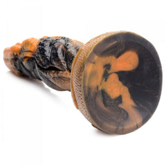 Close-up of Ravager dildo suction cup base with swirled amber and black silicone marbling