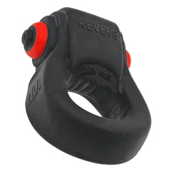 Rear angle of REVRING showing dual red buttons and textured silicone body detail