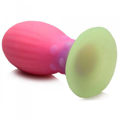 Rear-angle view of Xeno Egg displaying the wide green glow-in-the-dark suction base clearly