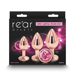 Rear Assets 3PC Metal Plug Kit packaging showing rose gold plugs with pink gemstone detail