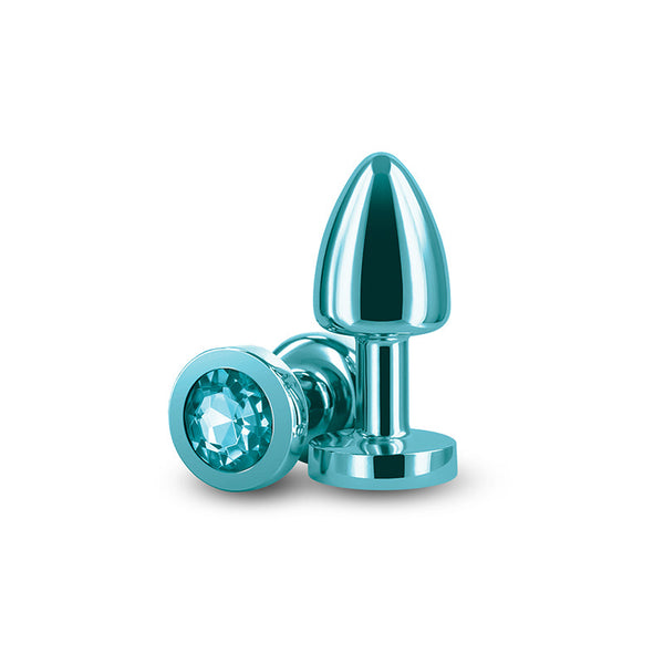 Rear Assets Petite anal plug in teal aluminum with matching aqua gemstone base, shown upright and lying flat