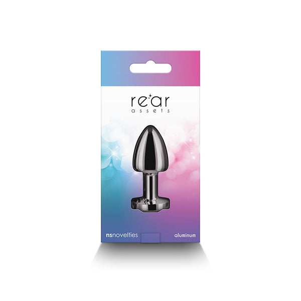 Rear Assets Petite gunmetal plug displayed inside gradient blue-pink NS Novelties retail box