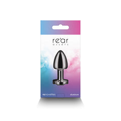 Rear Assets Petite gunmetal plug displayed inside gradient blue-pink NS Novelties retail box