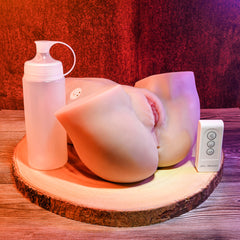 Rear Beauty stroker displayed with included lube applicator bottle and wireless remote control