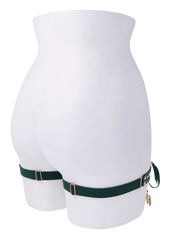 Rear view of green garter set on mannequin showing elastic back band and gold hardware