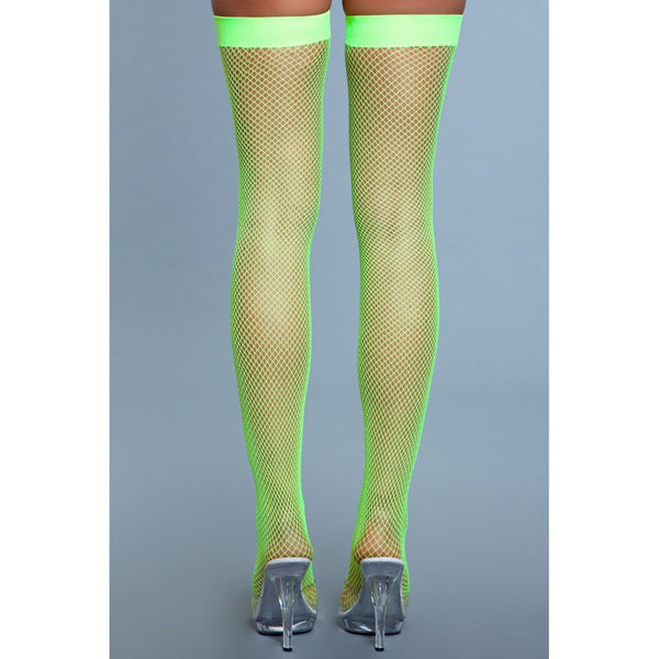 Rear view of neon green fishnet thigh highs displaying seam-free back and secure stay-up band