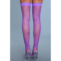 Rear view of purple fishnet thigh highs showing seamless fishnet texture