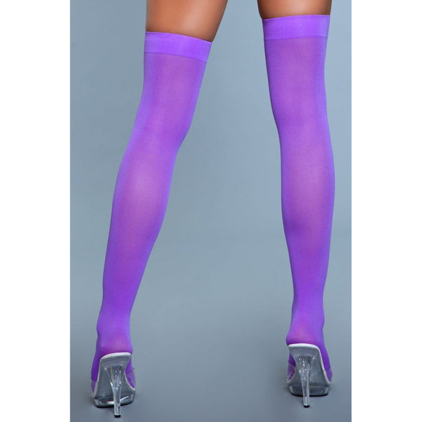Rear view of purple nylon thigh highs showing full-length opaque coverage and heel fit