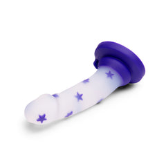Reclined angle showing curved shaft and purple suction base of the Starfloat Bliss Dildo
