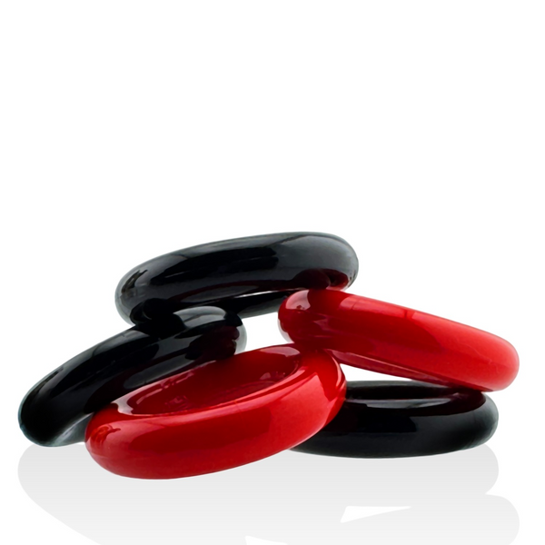 Red and black Hunkyjunk Jacker 5-Stack cockrings loosely arranged to show flexible form