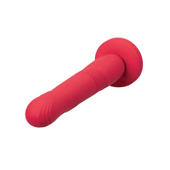 Red silicone Gravity dildo angled side view highlighting ridged texture detail and suction cup base