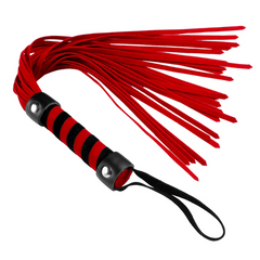 Red suede flogger close-up showing striped handle, metal studs, and splayed tails