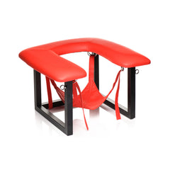 Red vegan leather queening chair with removable fabric sling and black metal frame, side view