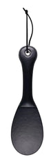 Reverse side of black vegan leather spanking paddle showing smooth solid striking surface