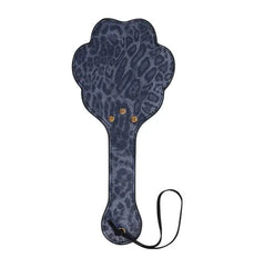 Reverse side of navy leopard-print paw paddle displaying stitched seams and gold studs