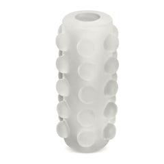 Close-up of the Reversible Orb's raised bubble exterior texture in soft translucent white material