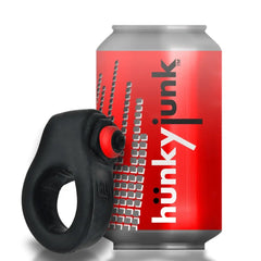 REVRING black silicone cock ring shown beside a standard soda can for size reference