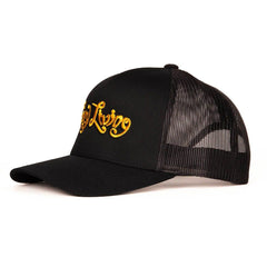 Right-side profile of black snapback cap with raised gold Sexy Living embroidered lettering