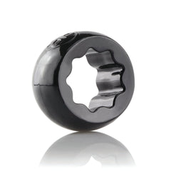 Ring O Ranglers Spur black cock ring at a side angle highlighting its star-shaped inner profile