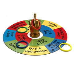 Ring Toss dare game board laid flat showing printed challenge segments in red, blue, yellow, green