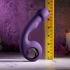 Rip Curl vibrator beside ruler showing approximately 7 inches total height, purple silicone