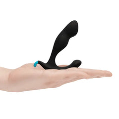 Rocker Plug resting in open palm showing compact lightweight silicone construction