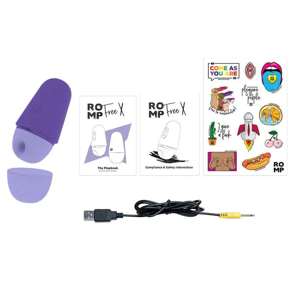 ROMP Free X unboxed contents: device, USB charging cable, instruction booklets, and sticker sheet