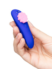 ROMP Party blue silicone panty vibrator held in hand showing compact curved shape