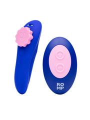 ROMP Party vibrator beside its oval blue and pink wireless remote control